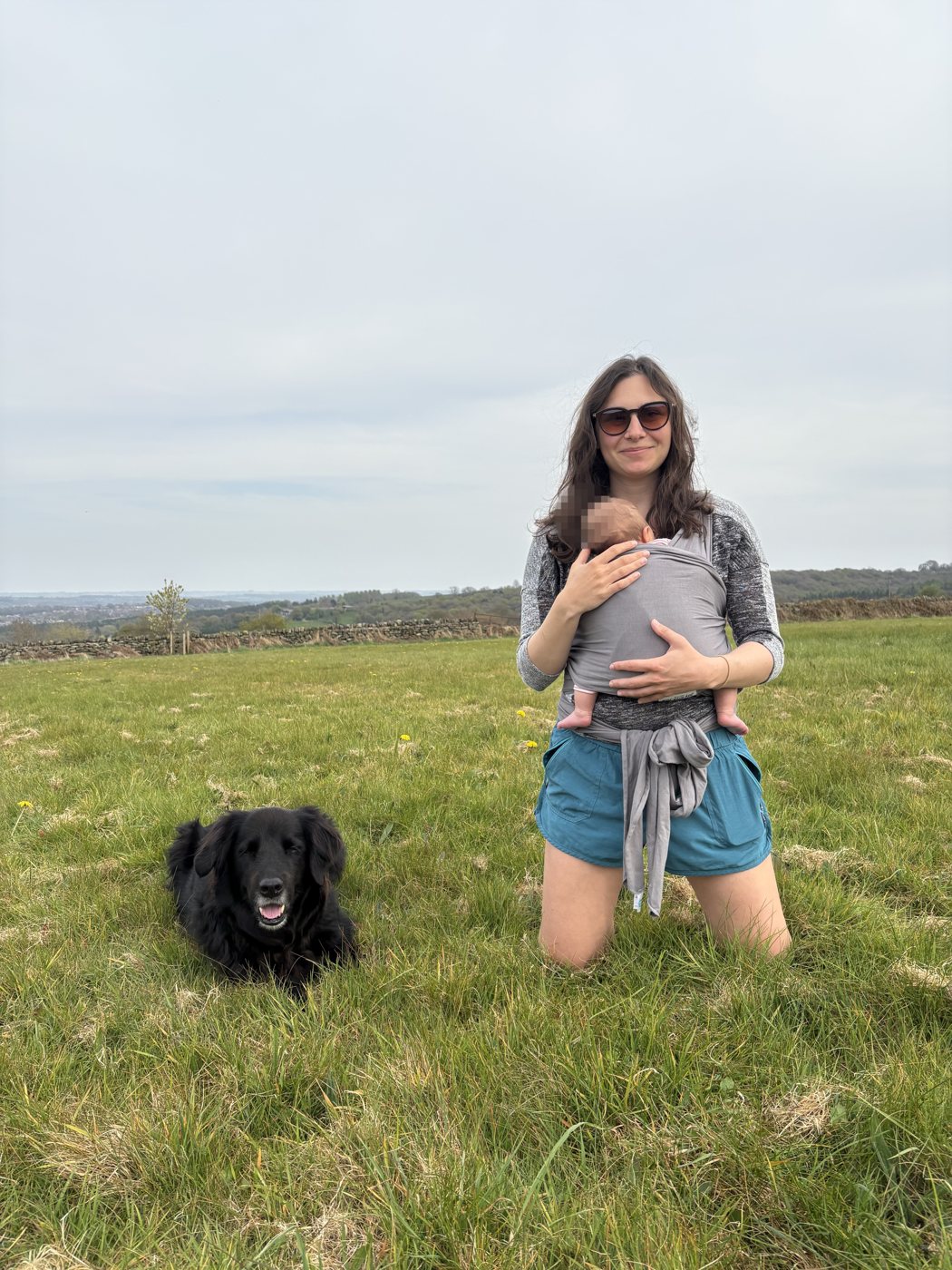 Scarlet babywearing on a walk with the dog